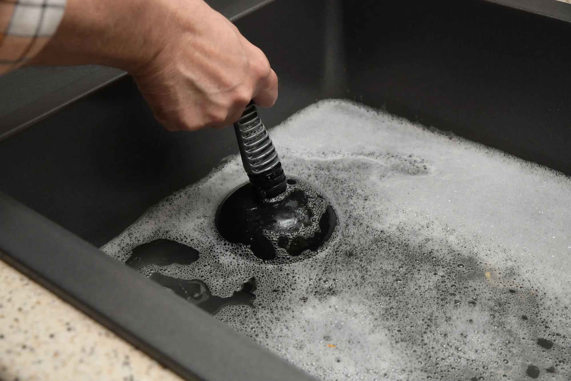 Plumber Seattle checking drain